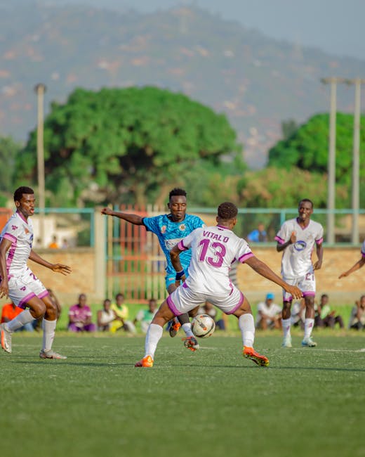 pexels photo 31105911 31105911 Vibrant action of a local football match in Burundi with energetic players.