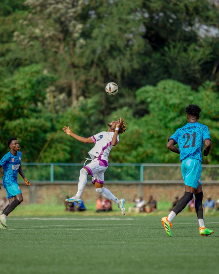 our-services-2 A thrilling moment captured in a soccer match with players in action.