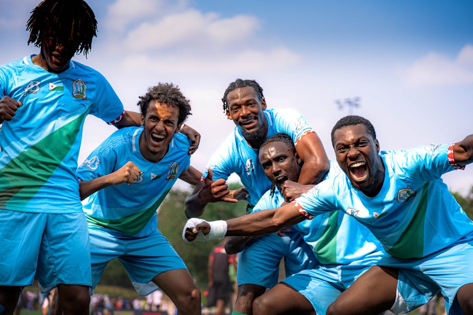 pexels photo 32879235 32879235 Group of soccer players joyfully celebrate victory outdoors in team uniforms.